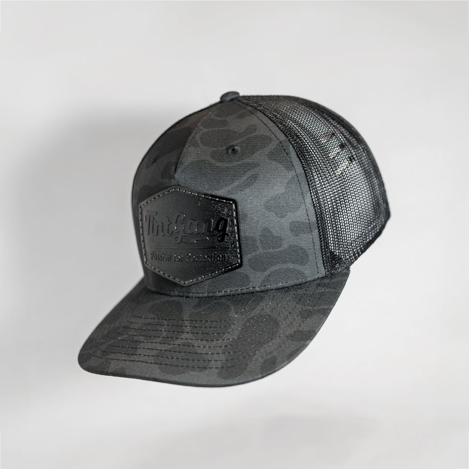 Tint Gang Camo Black Leather Patch Trucker Hat